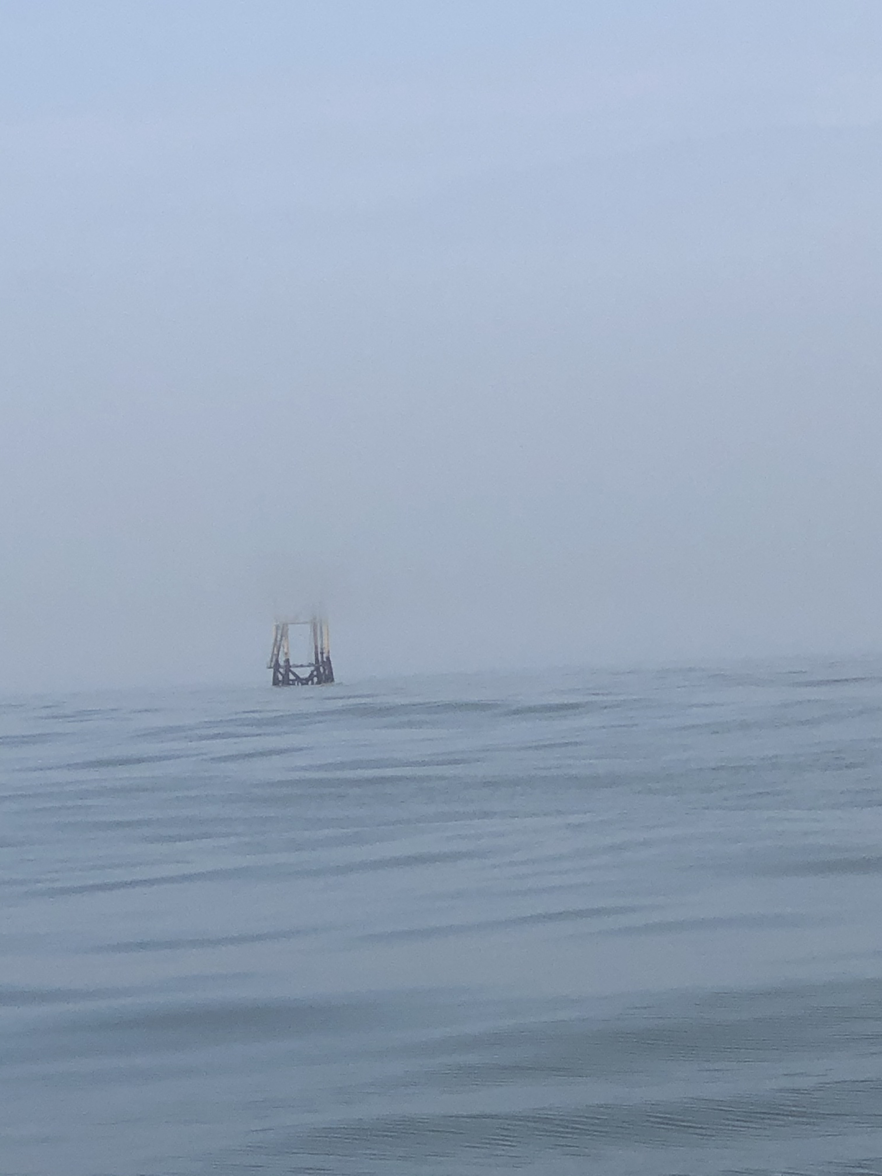 oil rig in fog