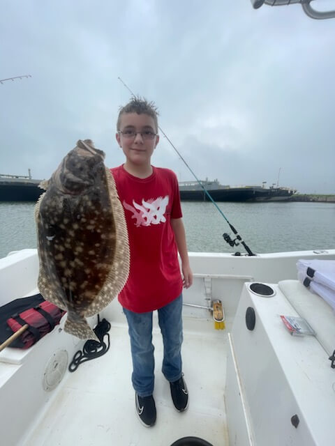 img! kid-caught-flounder
